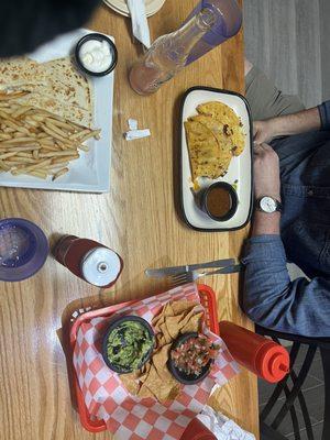 Full meal: rice and beans, chips and guacamole and salsa, kids, quesadilla, and fries