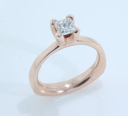 Rose gold Engagement ring set with a half carat princess cut diamond