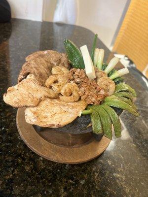 molcajete mezcal , ribeye, chicken breast, chorizo, shrimps, mexican cactus, jalapeño, baby onions