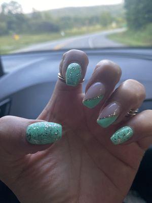 Gel X Seafoam with Gold glitter over solids and diagonal French with gold glitter line on middle fingers