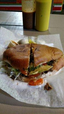 This tortas is flavorful, and it's as big as my face