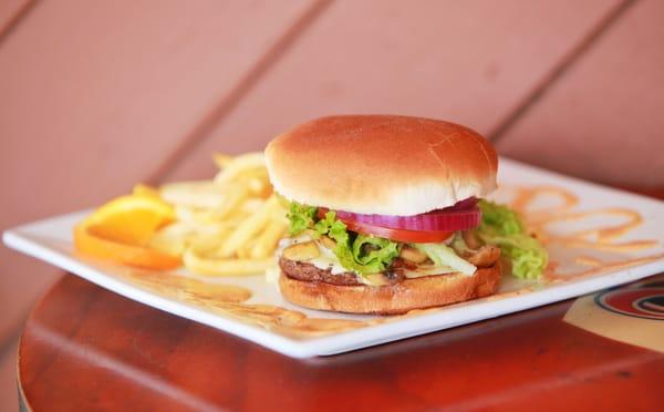 Mushroom Swiss Angus Burger with fries and chipotle aioli.