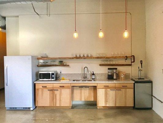 Open kitchen with fully stocked silverware and dishes.