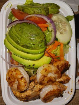 Avocado, salmon, and shrimp salad.