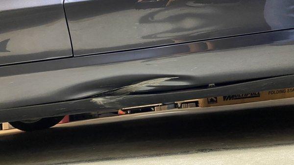 Dent in passenger side rocker panel