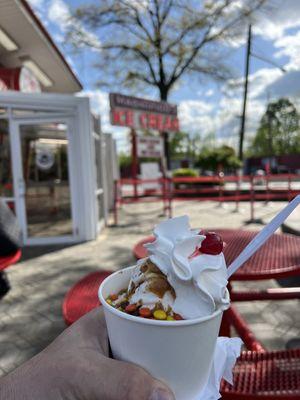 Vanilla soft serve with hot fudge,peanut butter sauce and Reese pieces