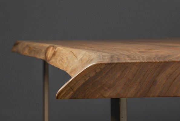 A live edge dining table with a top made from locally and naturally fallen English elm.