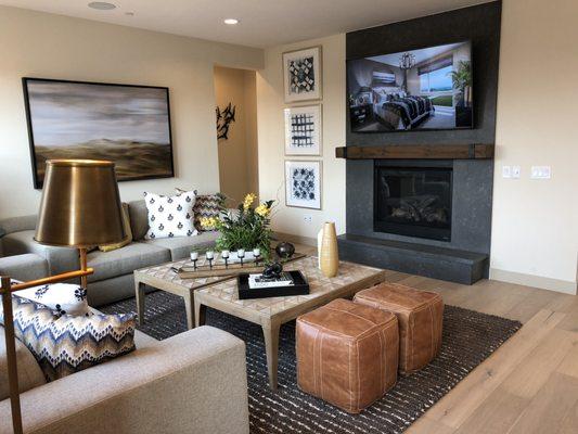 Hardwood living room and quartz slab fireplace surround