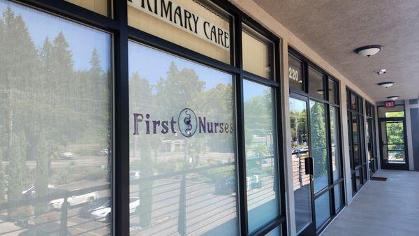 First Nurses front entry. We are located on the second floor of the building. The elevator entry is below our lighted building sign.