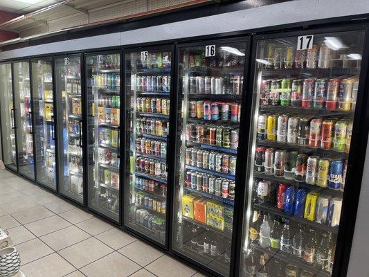 Multiple doors of mix-and-match craft beer six packs domestic German beer seltzers and more