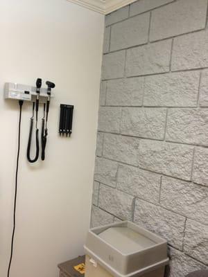 Oh yeah look at the fancy brick wall in the exam room....