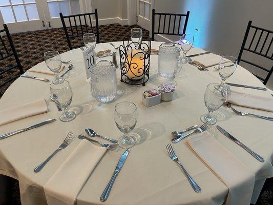 The setup table with a glimpse of the free candle centerpiece thing, available for weddings if you're not bringing your own centerpieces.