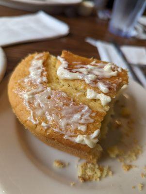 half portion (bc I devoured half prior to the idea of a photo) of cornbread. I smothered it with the honey butter it comes with. ‍