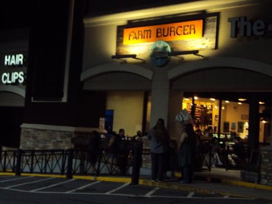 Front. Just look for the fake ice cream cone in front of the Farm Burger restaurant.