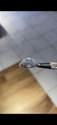 Three stone round diamond engagement ring.