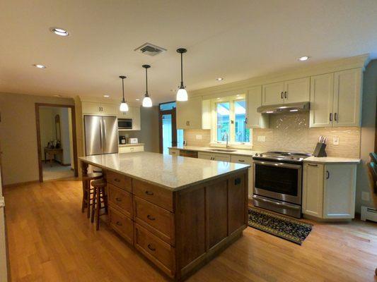 Quartz Countertop: Chakira Beige, Subway backsplash: Anatolia Marlow Paint finish cabinets with maple island