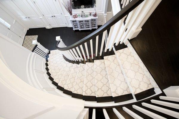 Featuring a @couristan runner atop red oak hardwood flooring with a custom stain.