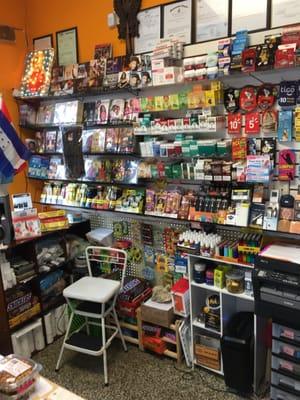 Behind the counter: Ethiopian DVDs/CDs, Cigarettes, phone cards, and Central American flags. Very unique market.