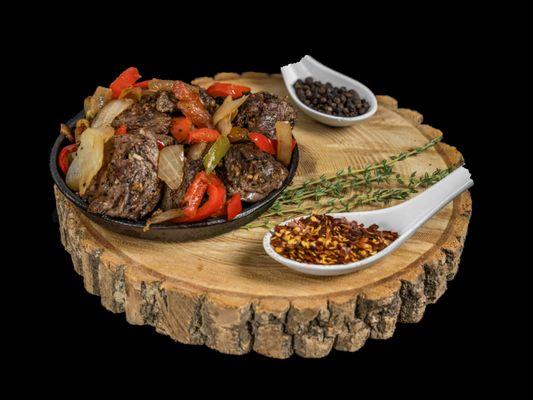 Caribbean steak tips, with cornbread and coconut rice