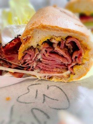 Cross section look at the Aks Hot Pastrami sandwich. Just awesome! +provolone cheese