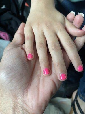 My daughter has nail polish on her hand and smudge on the pinky.