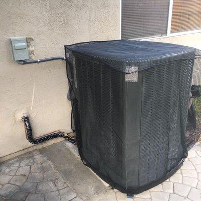 Trane 16XR outdoor condenser, with
 Sturdy Cover protection