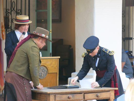 Signature of the “Capitulation of Cahuenga” by General Andrés Pico (left) and Colonel John Charles Frémont (right) during the re-enactment.