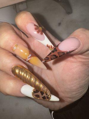 Fall trendy nail art on natural nails or nail extensions gel polish , shades of brown orange nude gold chrome