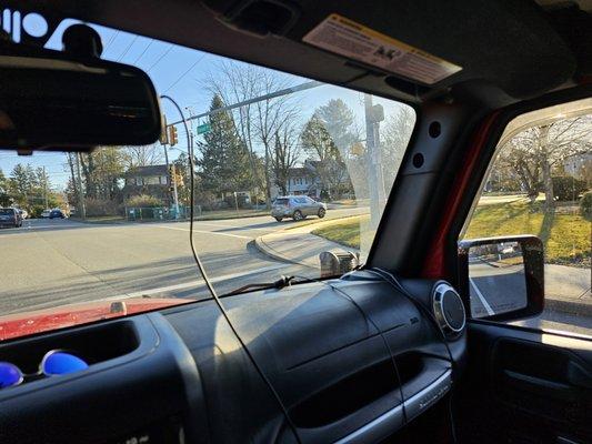 Wires left hanging from windshield