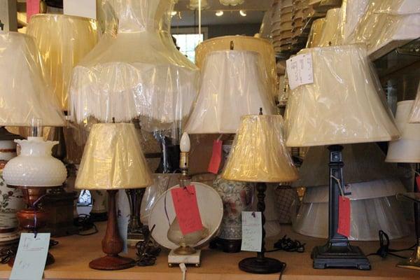 We carry lampshades in silk, linen, paper, mica, and glass.