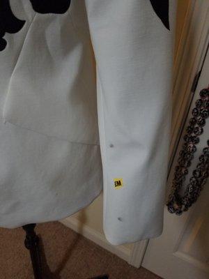 Brand new never been worn White House Black Marker blazer damaged by Dacula Cleaners.