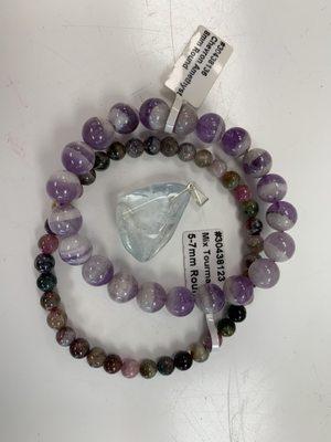 tourmaline bracelet, amethyst bracelet, and blue topaz necklace charm