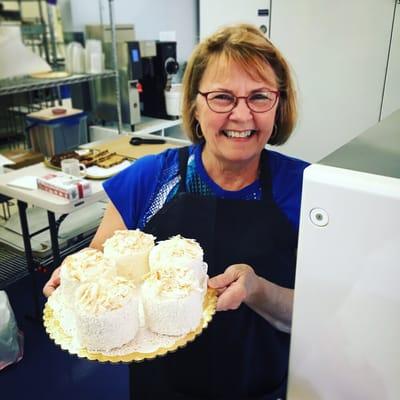 Kim Haines, the owner of Portland Style Cheesecake and Dessert Co., shows off our delicious coconut cakes!