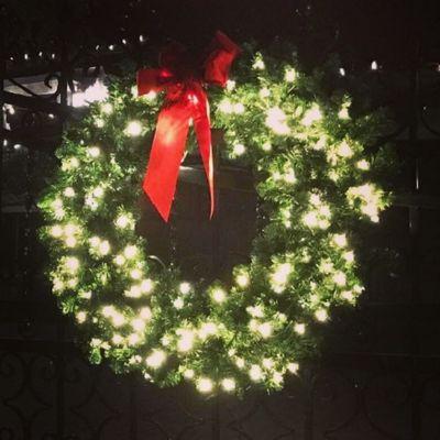 Holiday lighting Christmas Wreath, we install, remove and store each season.