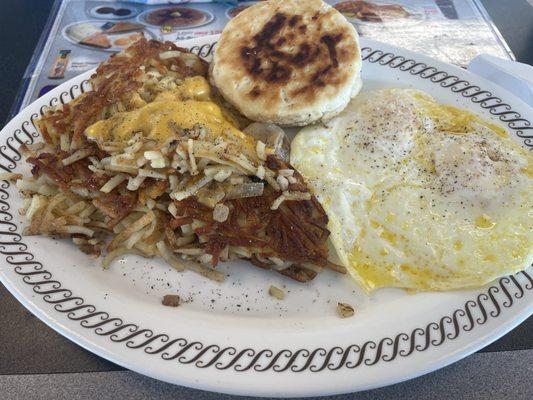 Smothered, covered and capped with easy eggs and a biscuit