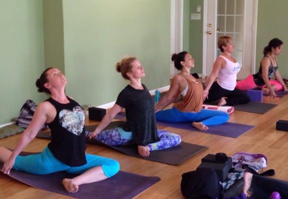 Hip opening pose in Vinyasa class