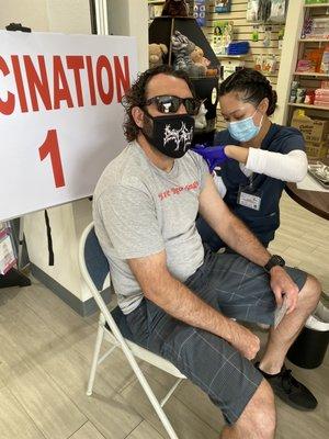 My boyfriend getting his vaccine. It took 2 seconds and was painless.