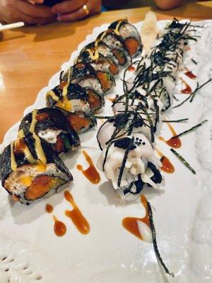 Dragon roll is spicy  and the black and white is sweeter