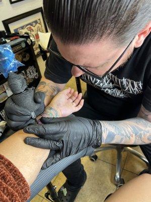 Artist Mike working on my cover up piece tattoo