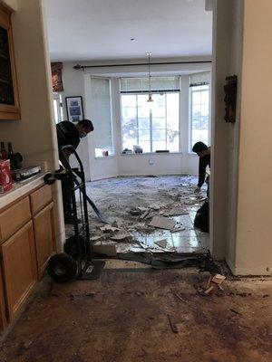 Taking out the kitchen tile floor.