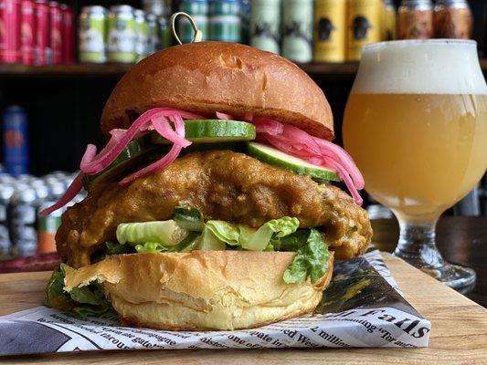 Bhattie Bird, Coconut curry fried chicken, pickled onion and cucumber with lettuce on toasted brioche