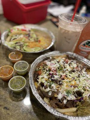 Carne Asada fries, taco plate(shrimp, pork and chicken) and horchata.