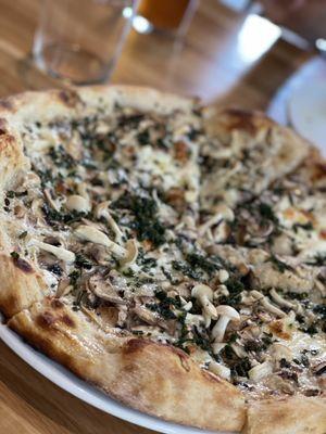 Mushroom pizza with Gruyère (so good. Incredible crust)