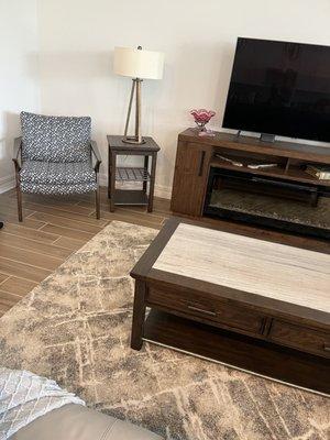 Wonderful accent chair and lamp and side table and rug!