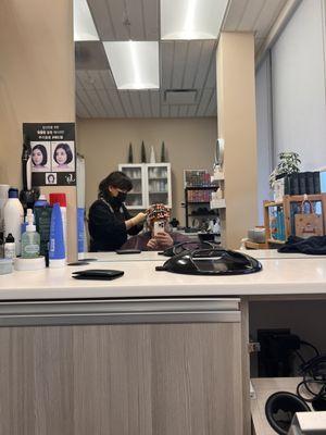 Getting a rod perm and haircut.