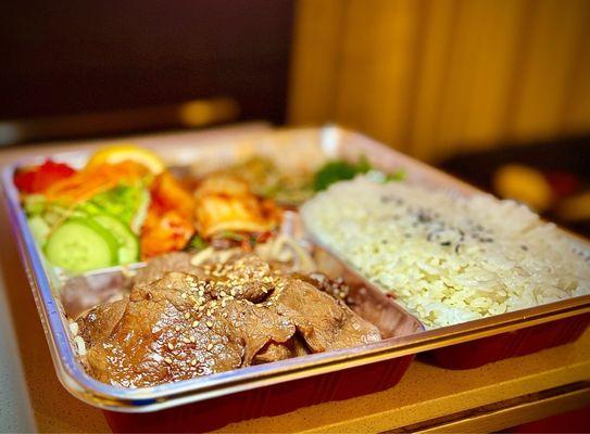 Yakiniku Beef bento box (bbq beef, sautéed bean sprouts, rice, salad, Home Made Kimchi, 2 types of japchae, & sautéed spinach.)