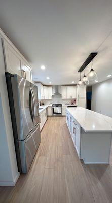 An all white kitchen can really help brighten and heighten a space! The mixed metals in this design add a modern element to a classic style!