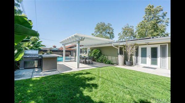 Back yard with built in BBQ grill and pool