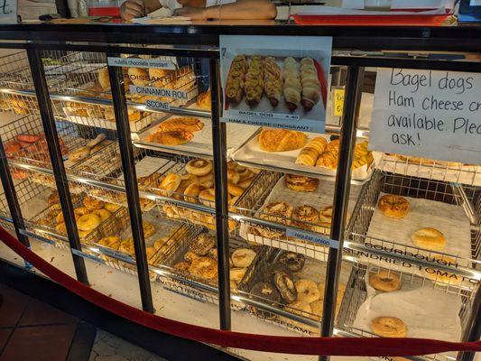 Place your order in front of the bagel display case.