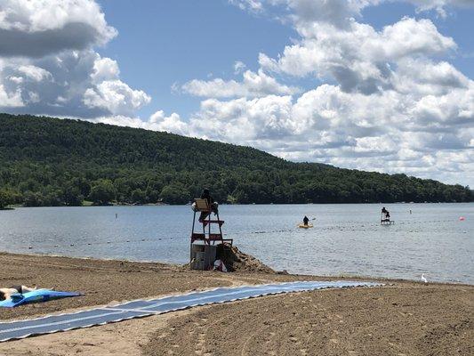 Beach area with lifeguard.